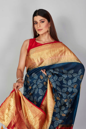 Buy dark blue silk Bandhej sari online in USA with red zari border. Look your best on festive occasions in latest designer saris, pure silk saris, Kanjivaram silk sarees, handwoven saris, tussar silk sarees, embroidered sarees from Pure Elegance Indian clothing store in USA.-closeup