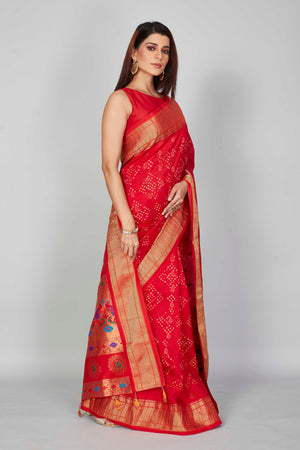 Shop red silk Bandhej sari online in USA with golden zari border. Look your best on festive occasions in latest designer saris, pure silk saris, Kanjivaram silk sarees, handwoven saris, tussar silk sarees, embroidered sarees from Pure Elegance Indian clothing store in USA.-side