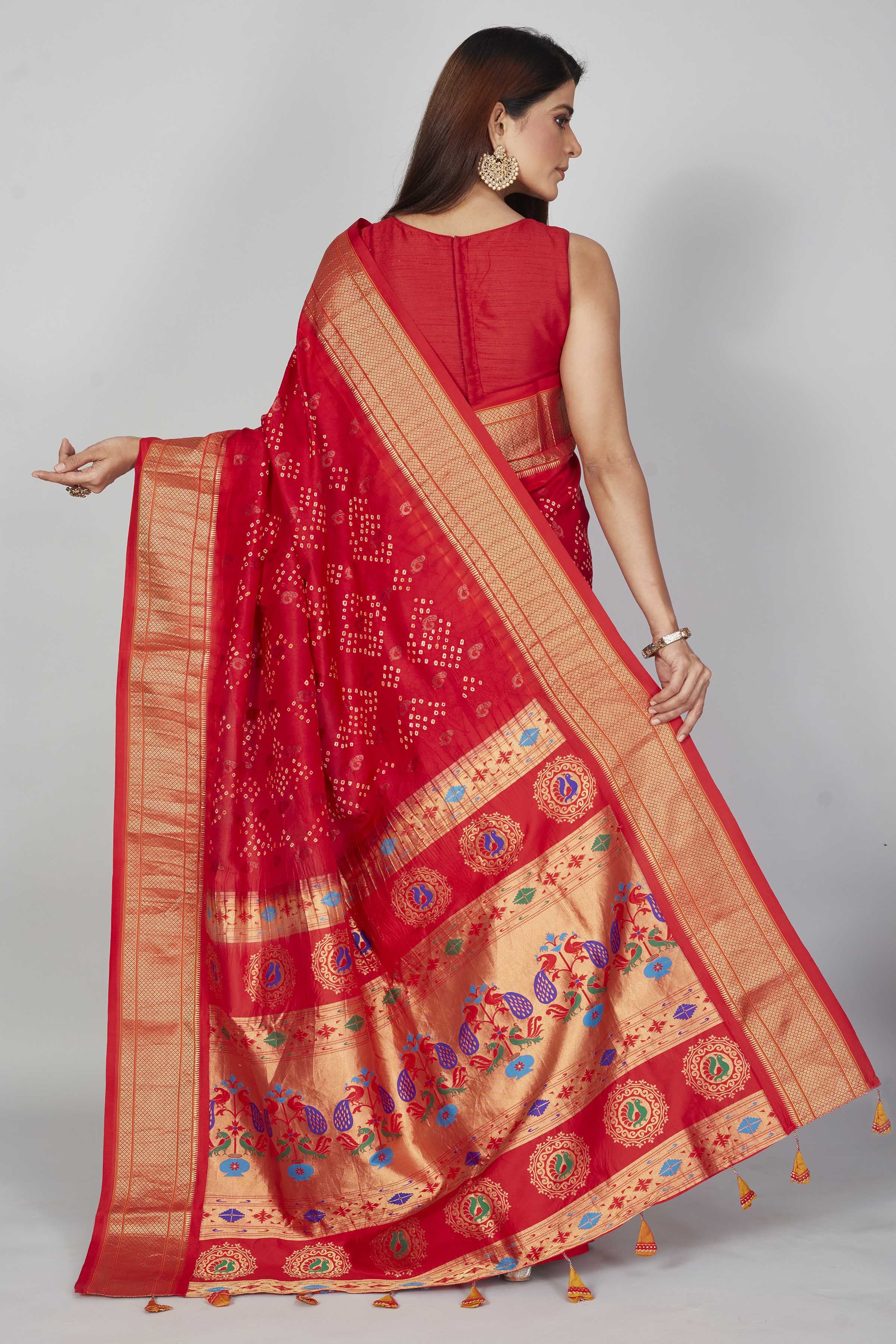 Shop red silk Bandhej sari online in USA with golden zari border. Look your best on festive occasions in latest designer saris, pure silk saris, Kanjivaram silk sarees, handwoven saris, tussar silk sarees, embroidered sarees from Pure Elegance Indian clothing store in USA.-back