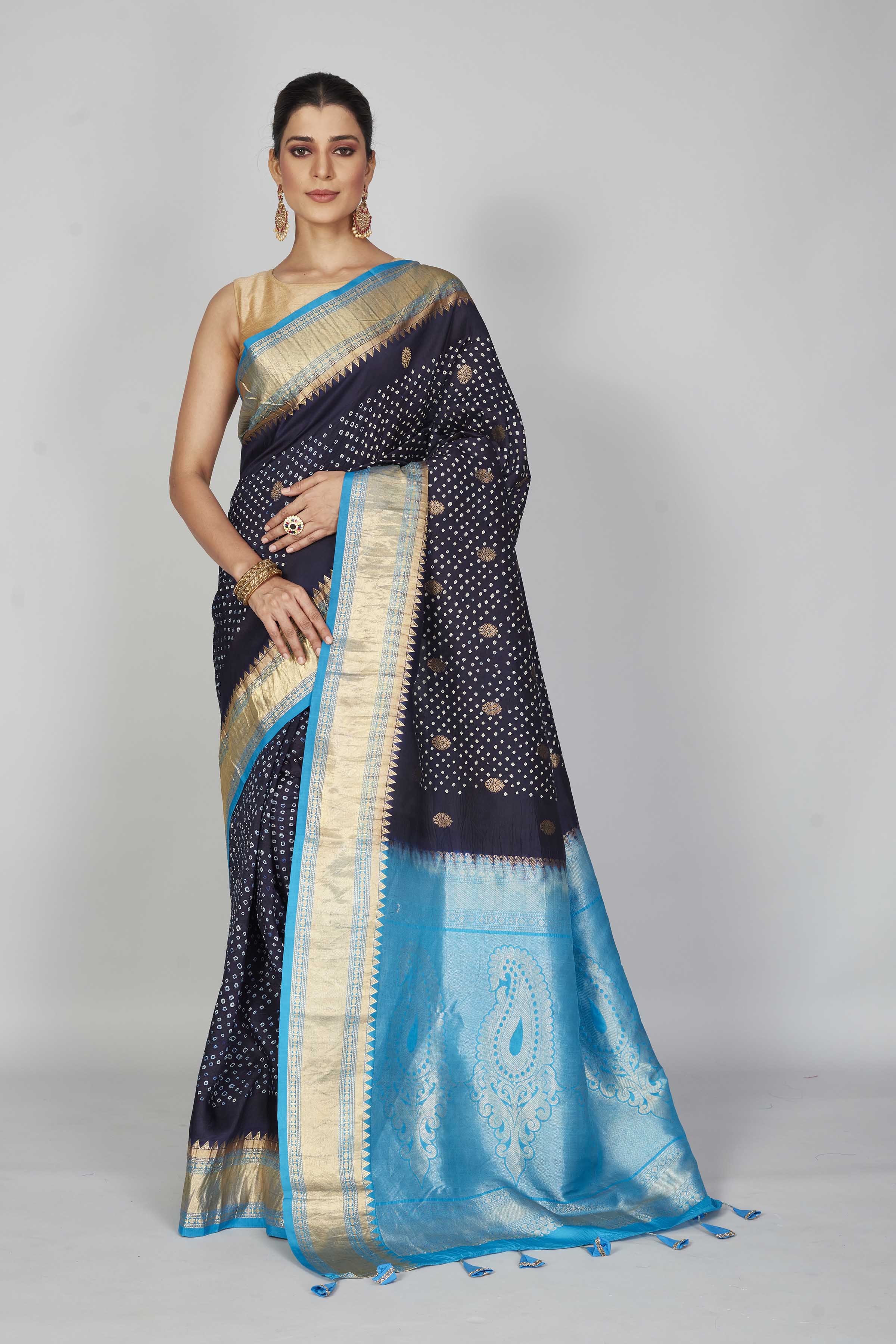 Shop navy blue silk Bandhej sari online in USA with light blue zari border. Look your best on festive occasions in latest designer saris, pure silk saris, Kanjivaram silk sarees, handwoven saris, tussar silk sarees, embroidered sarees from Pure Elegance Indian clothing store in USA.-full view