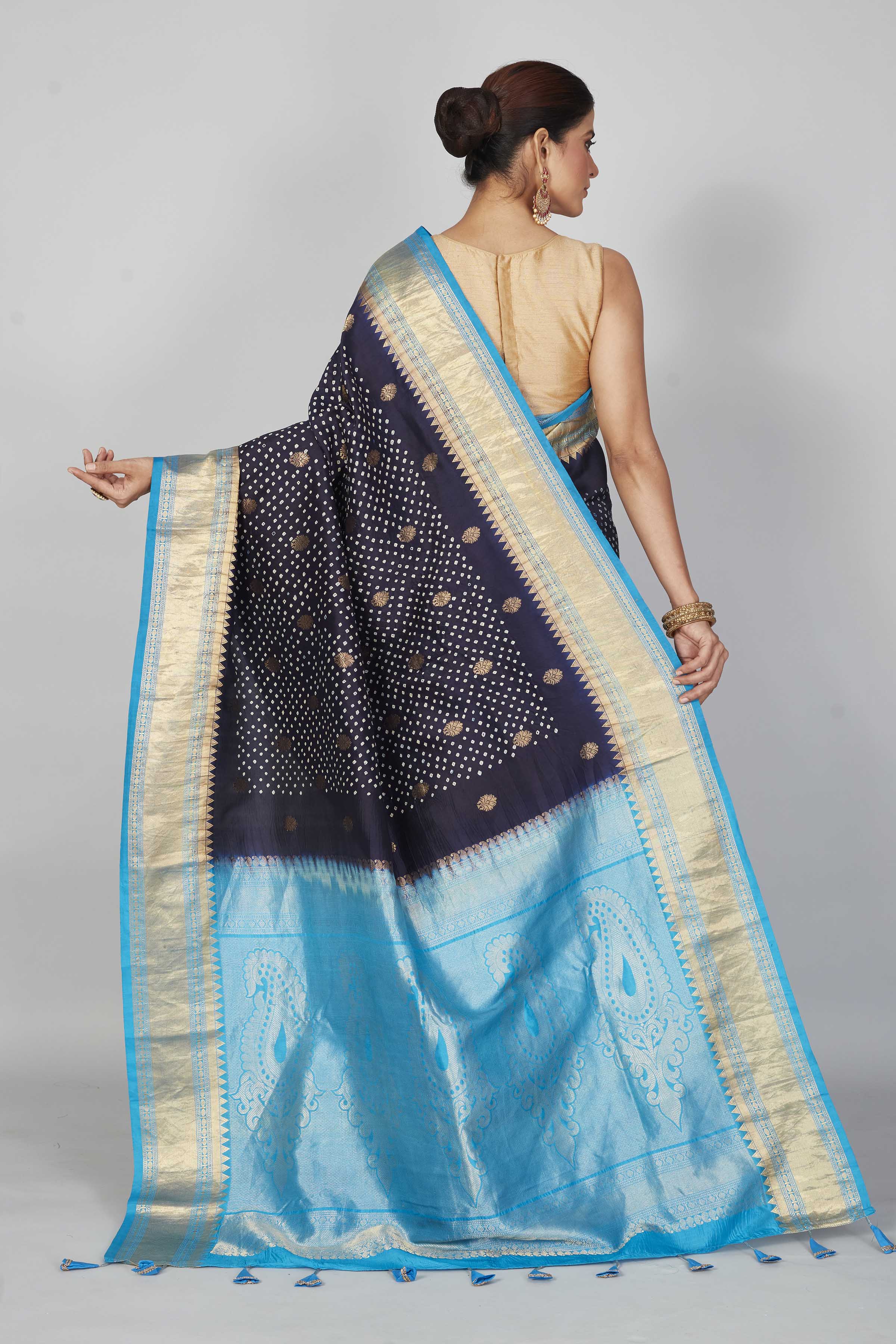 Shop navy blue silk Bandhej sari online in USA with light blue zari border. Look your best on festive occasions in latest designer saris, pure silk saris, Kanjivaram silk sarees, handwoven saris, tussar silk sarees, embroidered sarees from Pure Elegance Indian clothing store in USA.-back