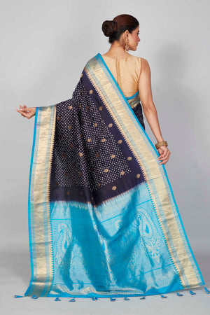 Shop navy blue silk Bandhej sari online in USA with light blue zari border. Look your best on festive occasions in latest designer saris, pure silk saris, Kanjivaram silk sarees, handwoven saris, tussar silk sarees, embroidered sarees from Pure Elegance Indian clothing store in USA.-back