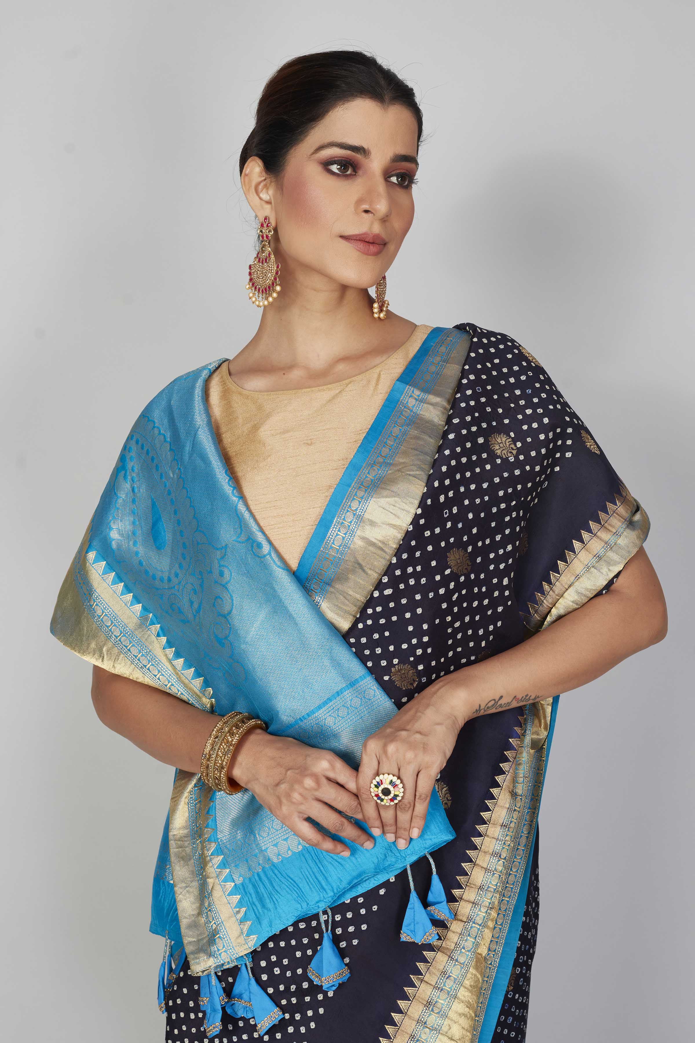 Shop navy blue silk Bandhej sari online in USA with light blue zari border. Look your best on festive occasions in latest designer saris, pure silk saris, Kanjivaram silk sarees, handwoven saris, tussar silk sarees, embroidered sarees from Pure Elegance Indian clothing store in USA.-closeup