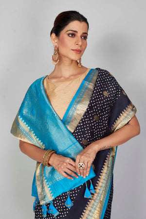 Shop navy blue silk Bandhej sari online in USA with light blue zari border. Look your best on festive occasions in latest designer saris, pure silk saris, Kanjivaram silk sarees, handwoven saris, tussar silk sarees, embroidered sarees from Pure Elegance Indian clothing store in USA.-closeup