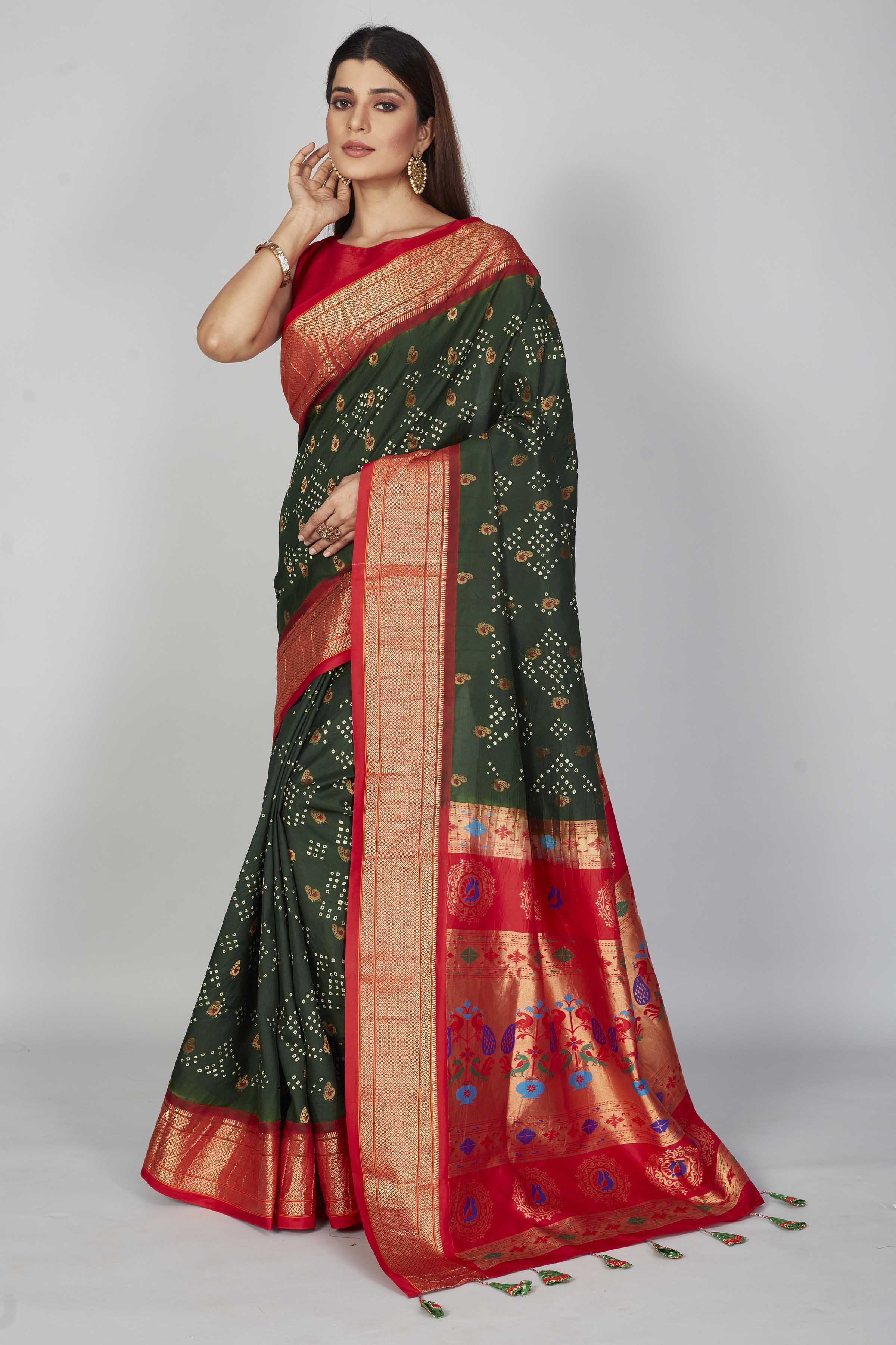 Buy dark green silk Bandhej saree online in USA with red zari border. Look your best on festive occasions in latest designer saris, pure silk saris, Kanjivaram silk sarees, handwoven saris, tussar silk sarees, embroidered sarees from Pure Elegance Indian clothing store in USA.-full view
