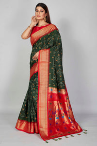 Buy dark green silk Bandhej saree online in USA with red zari border. Look your best on festive occasions in latest designer saris, pure silk saris, Kanjivaram silk sarees, handwoven saris, tussar silk sarees, embroidered sarees from Pure Elegance Indian clothing store in USA.-full view