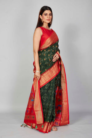 Buy dark green silk Bandhej saree online in USA with red zari border. Look your best on festive occasions in latest designer saris, pure silk saris, Kanjivaram silk sarees, handwoven saris, tussar silk sarees, embroidered sarees from Pure Elegance Indian clothing store in USA.-side