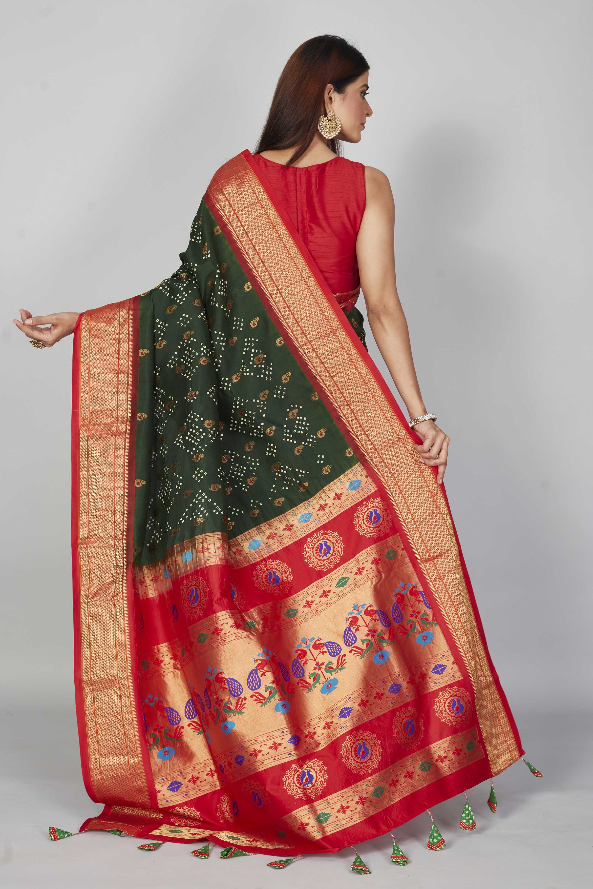 Buy dark green silk Bandhej saree online in USA with red zari border. Look your best on festive occasions in latest designer saris, pure silk saris, Kanjivaram silk sarees, handwoven saris, tussar silk sarees, embroidered sarees from Pure Elegance Indian clothing store in USA.-back