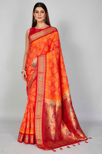 Buy orange Bandhej silk saree online in USA with red zari border. Look your best on festive occasions in latest designer saris, pure silk saris, Kanjivaram silk sarees, handwoven saris, tussar silk sarees, embroidered sarees from Pure Elegance Indian clothing store in USA.-full view