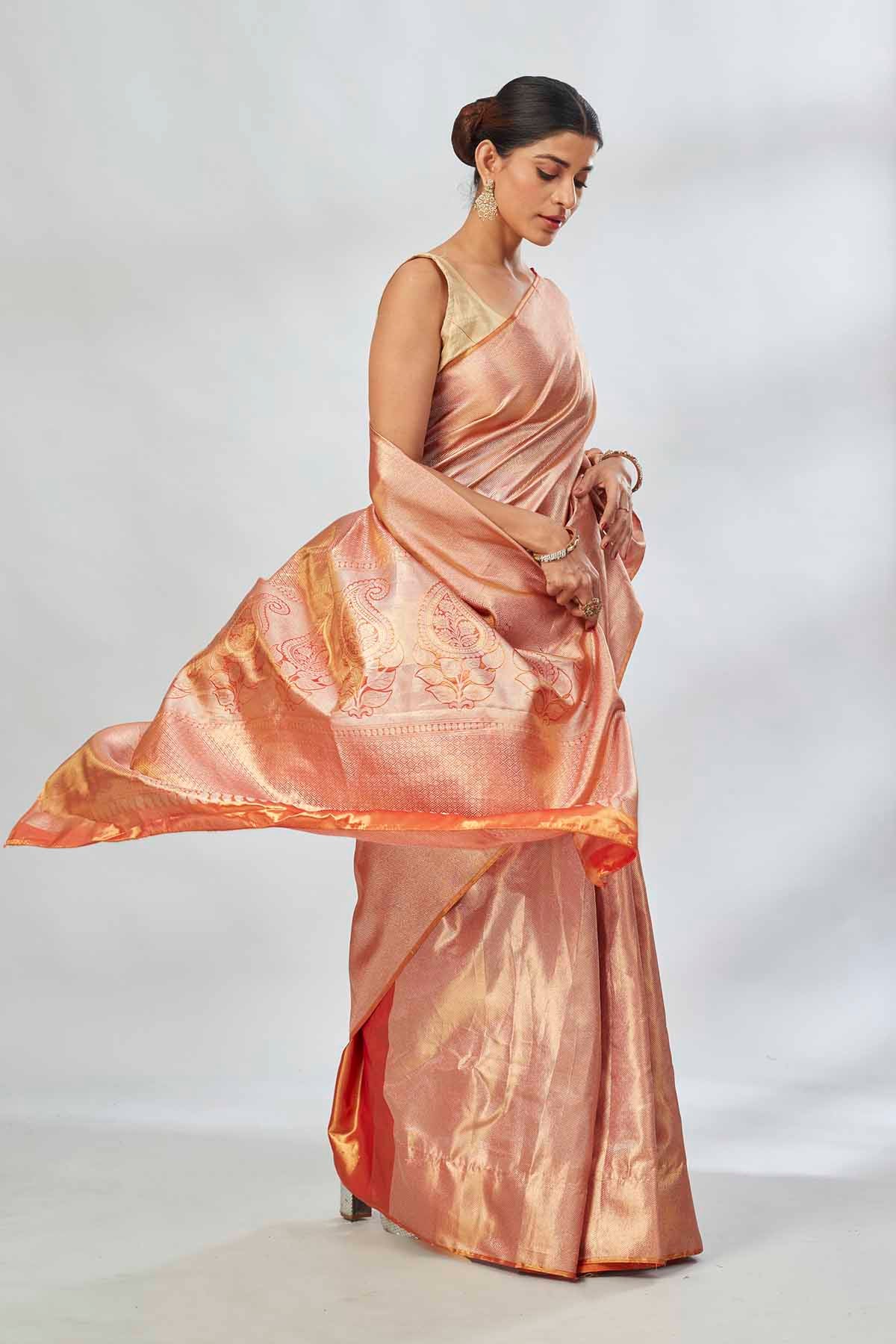 Buy beautiful orange tissue silk saree online in USA. Look your best on festive occasions in latest designer saris, pure silk saris, tissue silk sarees, handwoven saris, tussar silk sarees, linen sarees,  summer sarees from Pure Elegance Indian clothing store in USA.-side