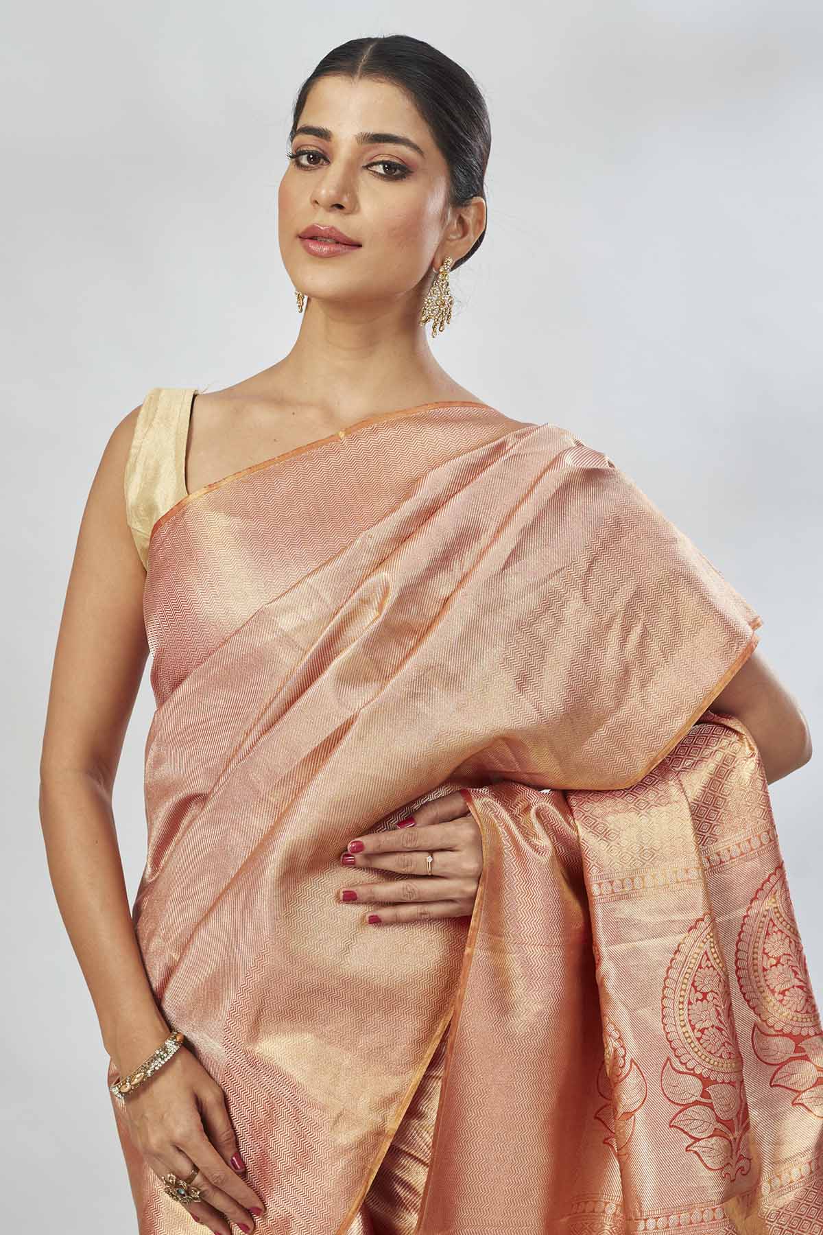 Buy beautiful orange tissue silk saree online in USA. Look your best on festive occasions in latest designer saris, pure silk saris, tissue silk sarees, handwoven saris, tussar silk sarees, linen sarees,  summer sarees from Pure Elegance Indian clothing store in USA.-closeup