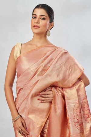 Buy beautiful orange tissue silk saree online in USA. Look your best on festive occasions in latest designer saris, pure silk saris, tissue silk sarees, handwoven saris, tussar silk sarees, linen sarees,  summer sarees from Pure Elegance Indian clothing store in USA.-closeup