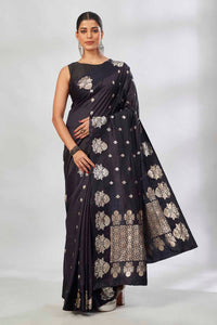 Buy black Mashru silk saree online in USA with silver zari buti and pallu. Look your best on festive occasions in latest designer saris, pure silk saris, tissue silk sarees, handwoven saris, tussar silk sarees, linen sarees,  summer sarees from Pure Elegance Indian clothing store in USA.-full view
