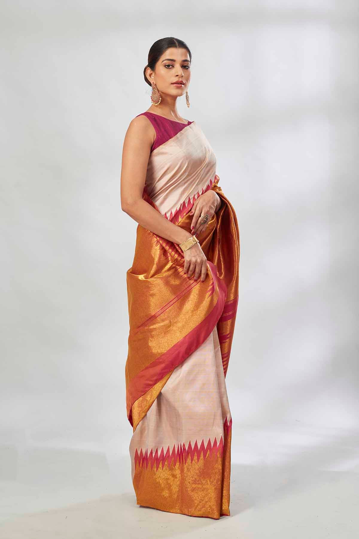Buy off-white Kanjeevaram silk sari online in USA with golden zari border. Look your best on festive occasions in latest designer saris, pure silk saris, tissue silk sarees, handwoven saris, tussar silk sarees, linen sarees,  summer sarees from Pure Elegance Indian clothing store in USA.-side