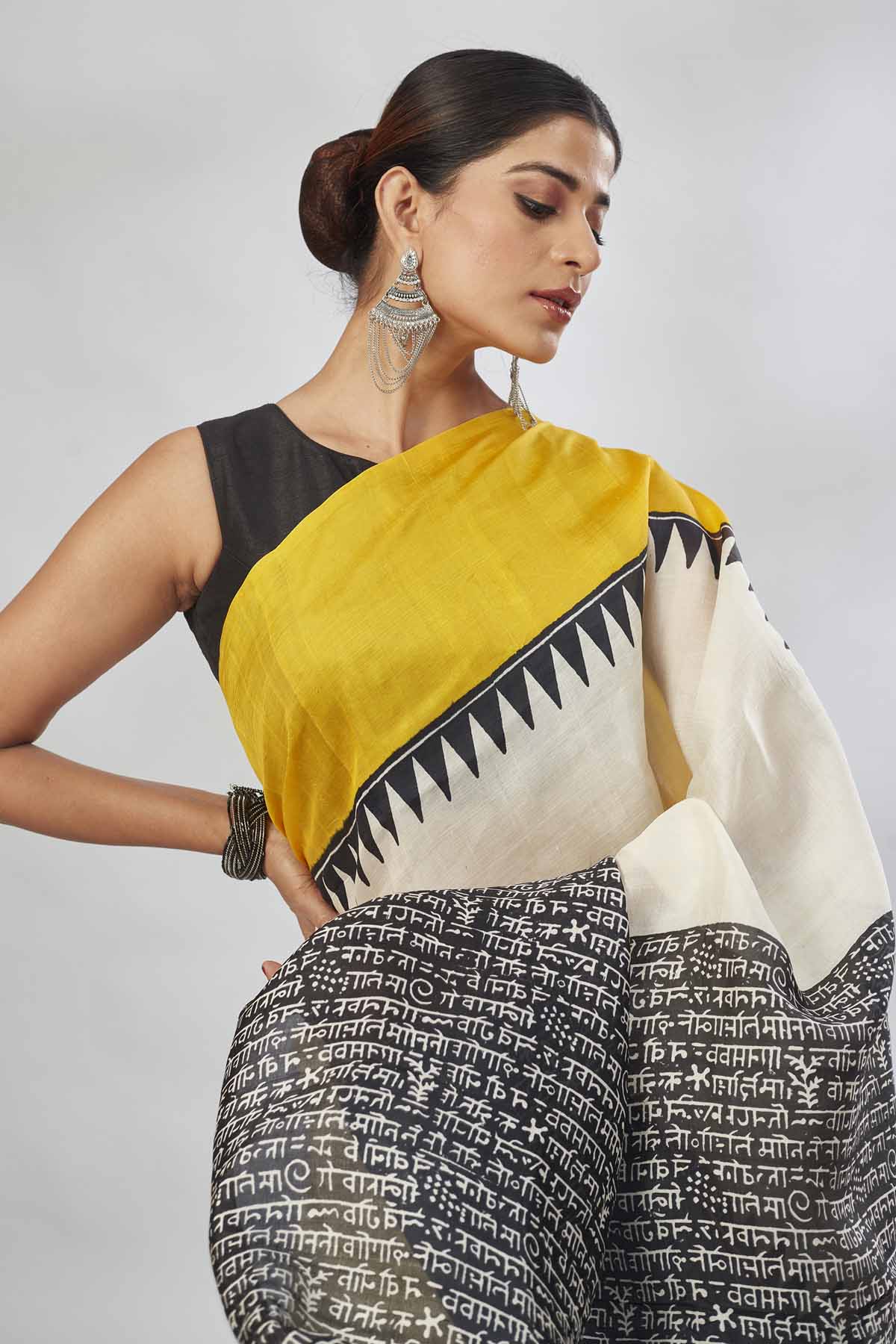Buy cream batik print saree online in USA with yellow and blue border. Look your best on festive occasions in latest designer saris, pure silk saris, tissue silk sarees, handwoven saris, tussar silk sarees, linen sarees,  summer sarees from Pure Elegance Indian clothing store in USA.-closeup