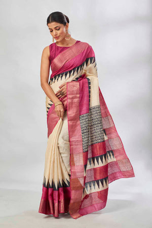 Shop cream batik print saree online in USA with pink zari border. Look your best on festive occasions in latest designer saris, pure silk saris, tissue silk sarees, handwoven saris, tussar silk sarees, linen sarees,  summer sarees from Pure Elegance Indian clothing store in USA.-side
