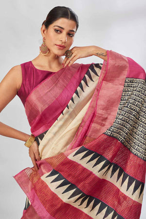 Shop cream batik print saree online in USA with pink zari border. Look your best on festive occasions in latest designer saris, pure silk saris, tissue silk sarees, handwoven saris, tussar silk sarees, linen sarees,  summer sarees from Pure Elegance Indian clothing store in USA.-closeup