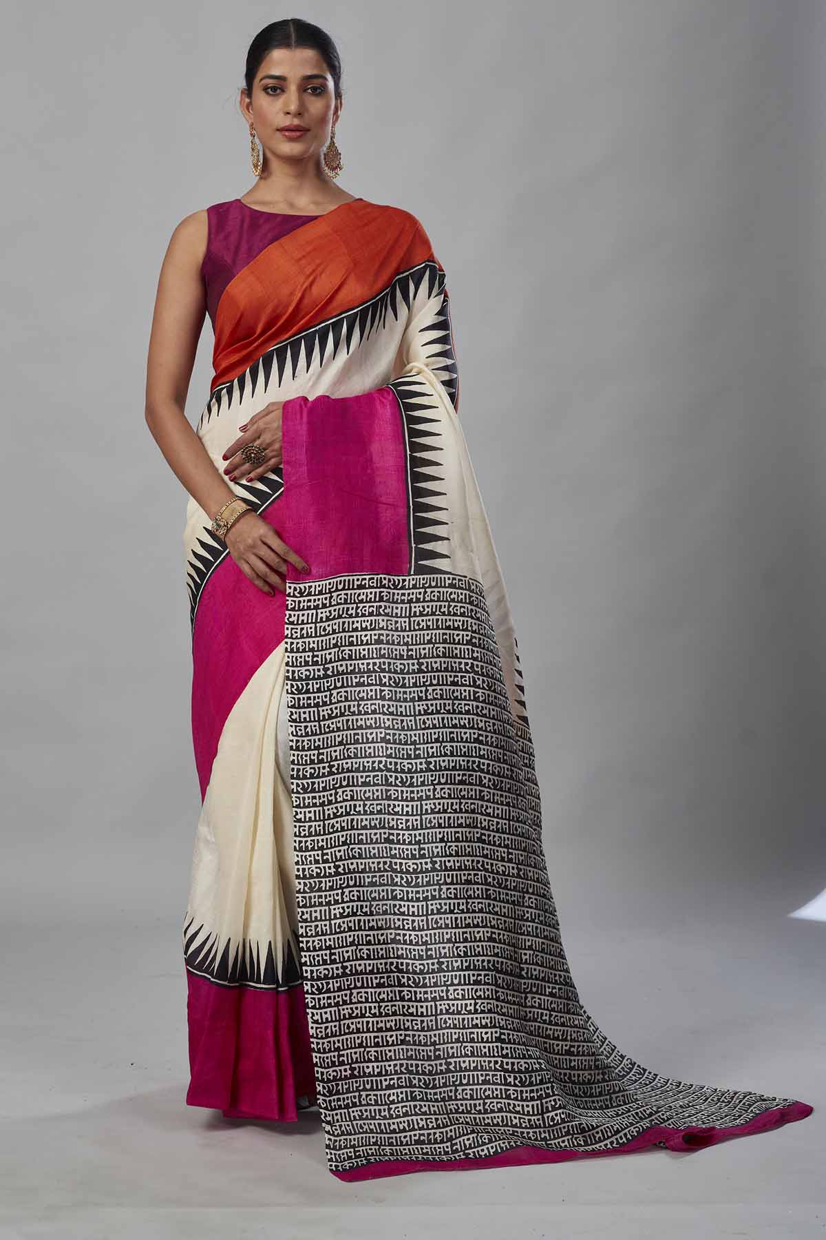 Buy cream batik print saree online in USA with orange and pink border. Look your best on festive occasions in latest designer saris, pure silk saris, tissue silk sarees, handwoven saris, tussar silk sarees, linen sarees,  summer sarees from Pure Elegance Indian clothing store in USA.-full view