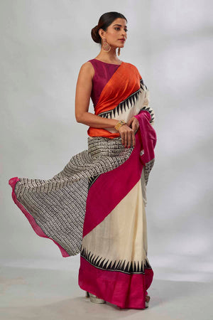 Buy cream batik print saree online in USA with orange and pink border. Look your best on festive occasions in latest designer saris, pure silk saris, tissue silk sarees, handwoven saris, tussar silk sarees, linen sarees,  summer sarees from Pure Elegance Indian clothing store in USA.-side