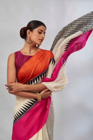 Buy cream batik print saree online in USA with orange and pink border. Look your best on festive occasions in latest designer saris, pure silk saris, tissue silk sarees, handwoven saris, tussar silk sarees, linen sarees,  summer sarees from Pure Elegance Indian clothing store in USA.-closeup