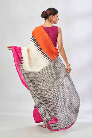 Buy cream batik print saree online in USA with orange and pink border. Look your best on festive occasions in latest designer saris, pure silk saris, tissue silk sarees, handwoven saris, tussar silk sarees, linen sarees,  summer sarees from Pure Elegance Indian clothing store in USA.-back