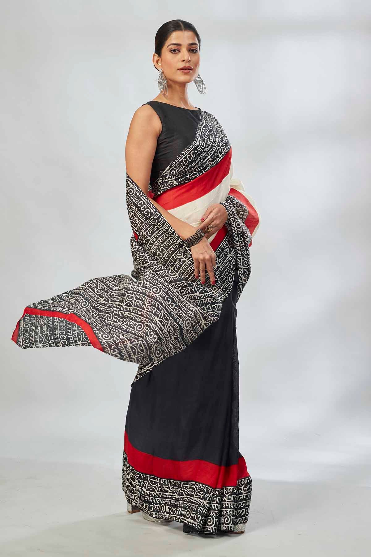 Shop elegant off-white and red black batik print saree online in USA. Look your best on festive occasions in latest designer saris, pure silk saris, tissue silk sarees, handwoven saris, tussar silk sarees, linen sarees,  summer sarees from Pure Elegance Indian clothing store in USA.-side