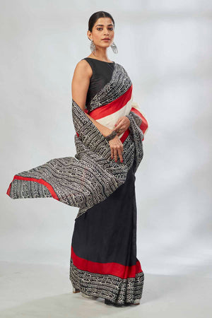 Shop elegant off-white and red black batik print saree online in USA. Look your best on festive occasions in latest designer saris, pure silk saris, tissue silk sarees, handwoven saris, tussar silk sarees, linen sarees,  summer sarees from Pure Elegance Indian clothing store in USA.-side