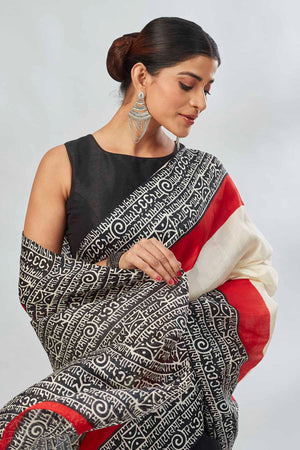 Shop elegant off-white and red black batik print saree online in USA. Look your best on festive occasions in latest designer saris, pure silk saris, tissue silk sarees, handwoven saris, tussar silk sarees, linen sarees,  summer sarees from Pure Elegance Indian clothing store in USA.-closeup