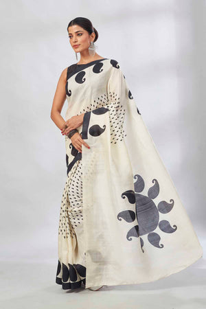 Shop elegant white batik print saree online in USA. Look your best on festive occasions in latest designer saris, pure silk saris, tissue silk sarees, handwoven saris, tussar silk sarees, linen sarees,  summer sarees from Pure Elegance Indian clothing store in USA.-pallu