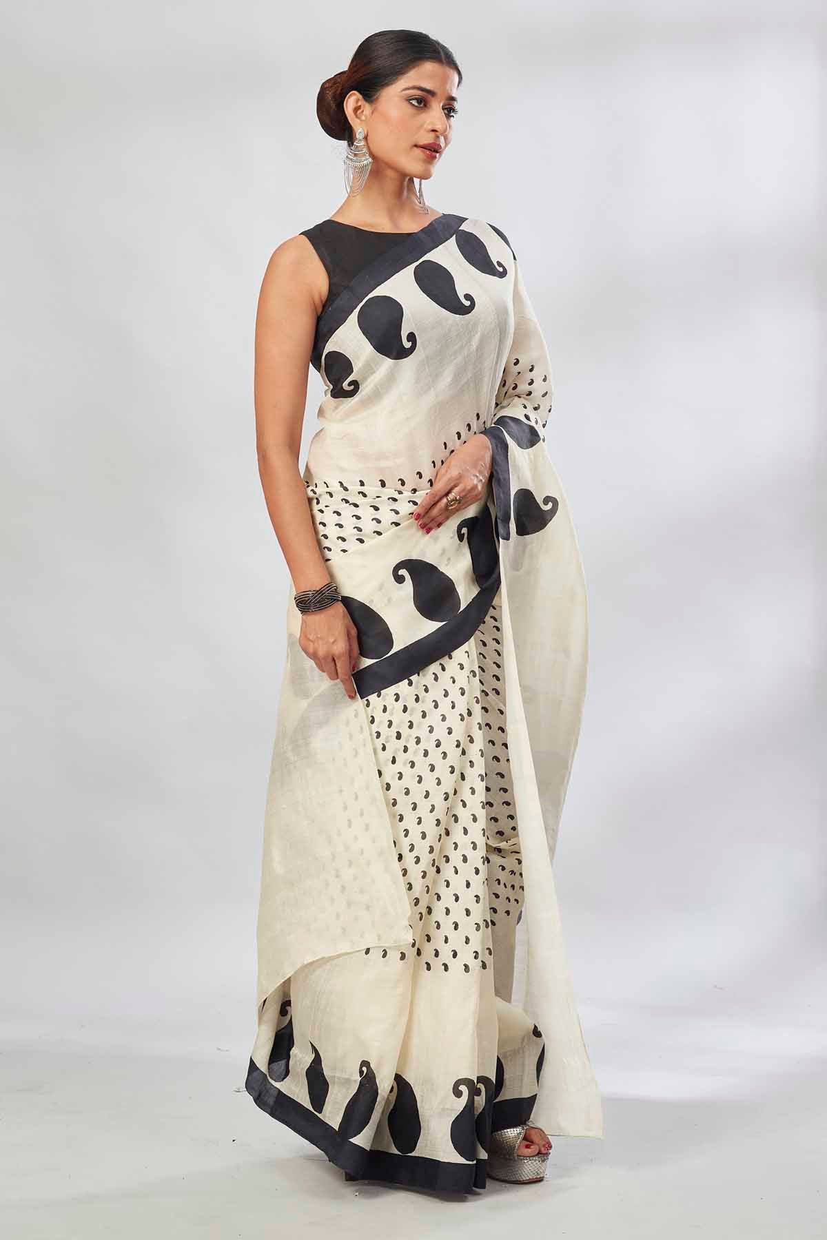 Shop elegant white batik print saree online in USA. Look your best on festive occasions in latest designer saris, pure silk saris, tissue silk sarees, handwoven saris, tussar silk sarees, linen sarees,  summer sarees from Pure Elegance Indian clothing store in USA.-saree
