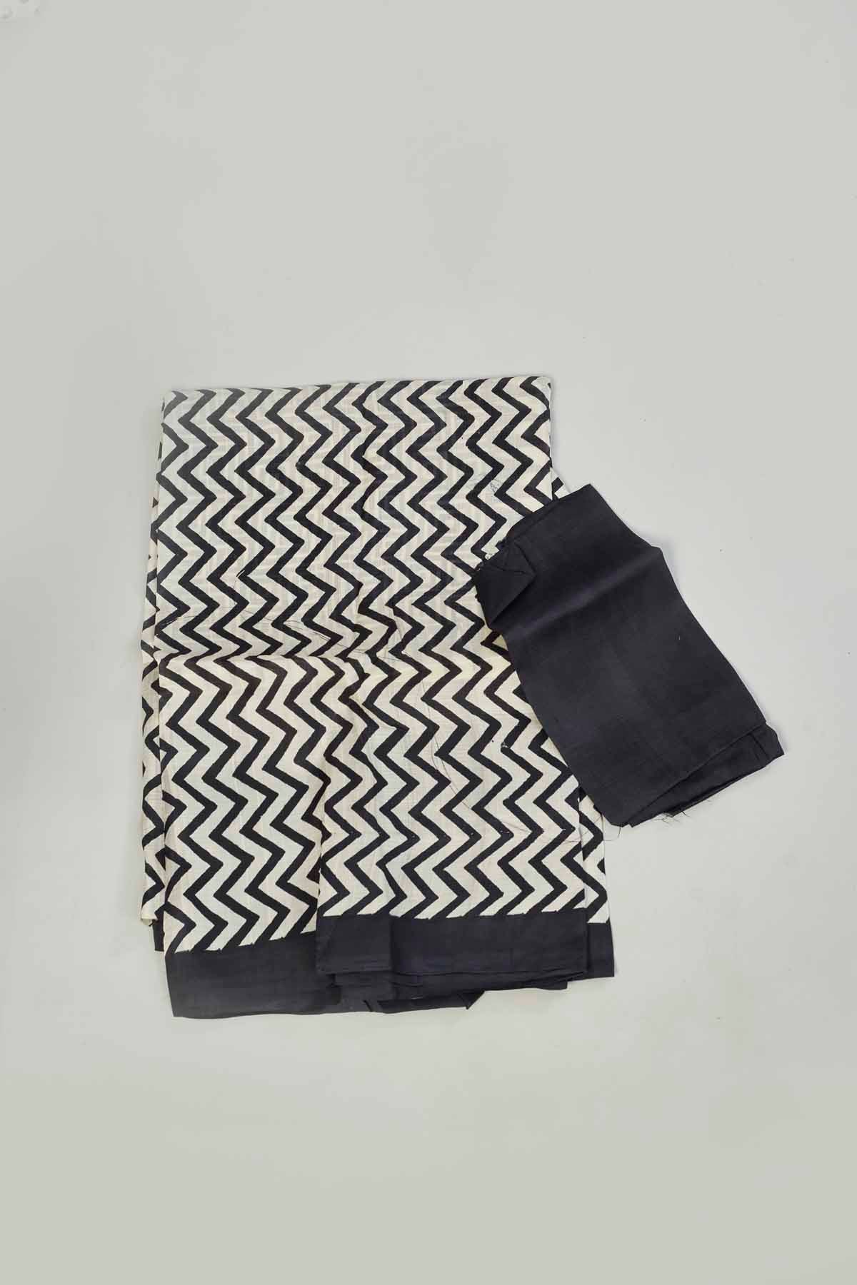 Buy white and black batik print saree online in USA. Look your best on festive occasions in latest designer saris, pure silk saris, tissue silk sarees, handwoven saris, tussar silk sarees, linen sarees,  summer sarees from Pure Elegance Indian clothing store in USA.-blouse