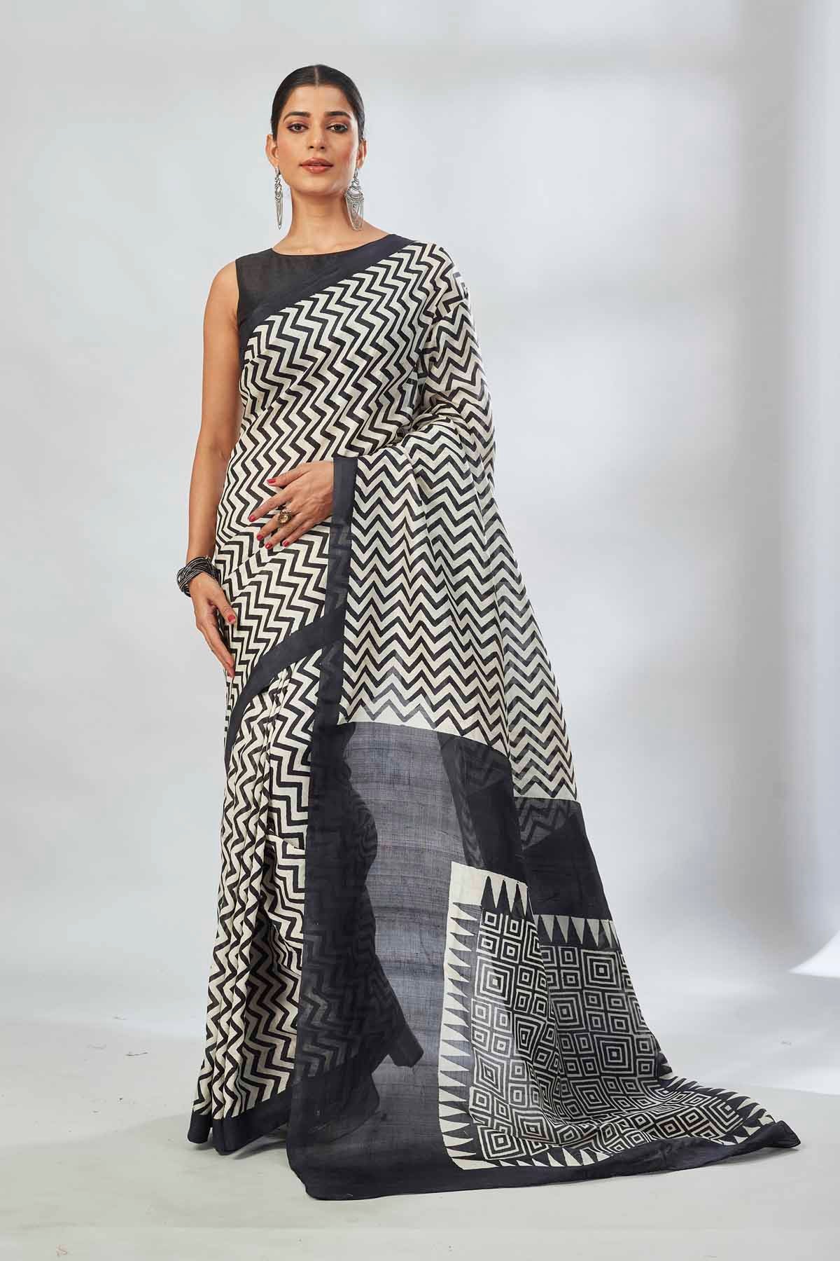 Buy white and black batik print saree online in USA. Look your best on festive occasions in latest designer saris, pure silk saris, tissue silk sarees, handwoven saris, tussar silk sarees, linen sarees,  summer sarees from Pure Elegance Indian clothing store in USA.-full view