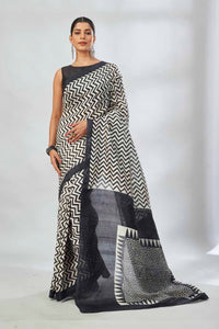 Buy white and black batik print saree online in USA. Look your best on festive occasions in latest designer saris, pure silk saris, tissue silk sarees, handwoven saris, tussar silk sarees, linen sarees,  summer sarees from Pure Elegance Indian clothing store in USA.-full view