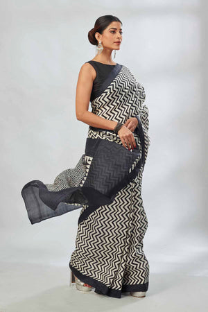 Buy white and black batik print saree online in USA. Look your best on festive occasions in latest designer saris, pure silk saris, tissue silk sarees, handwoven saris, tussar silk sarees, linen sarees,  summer sarees from Pure Elegance Indian clothing store in USA.-side
