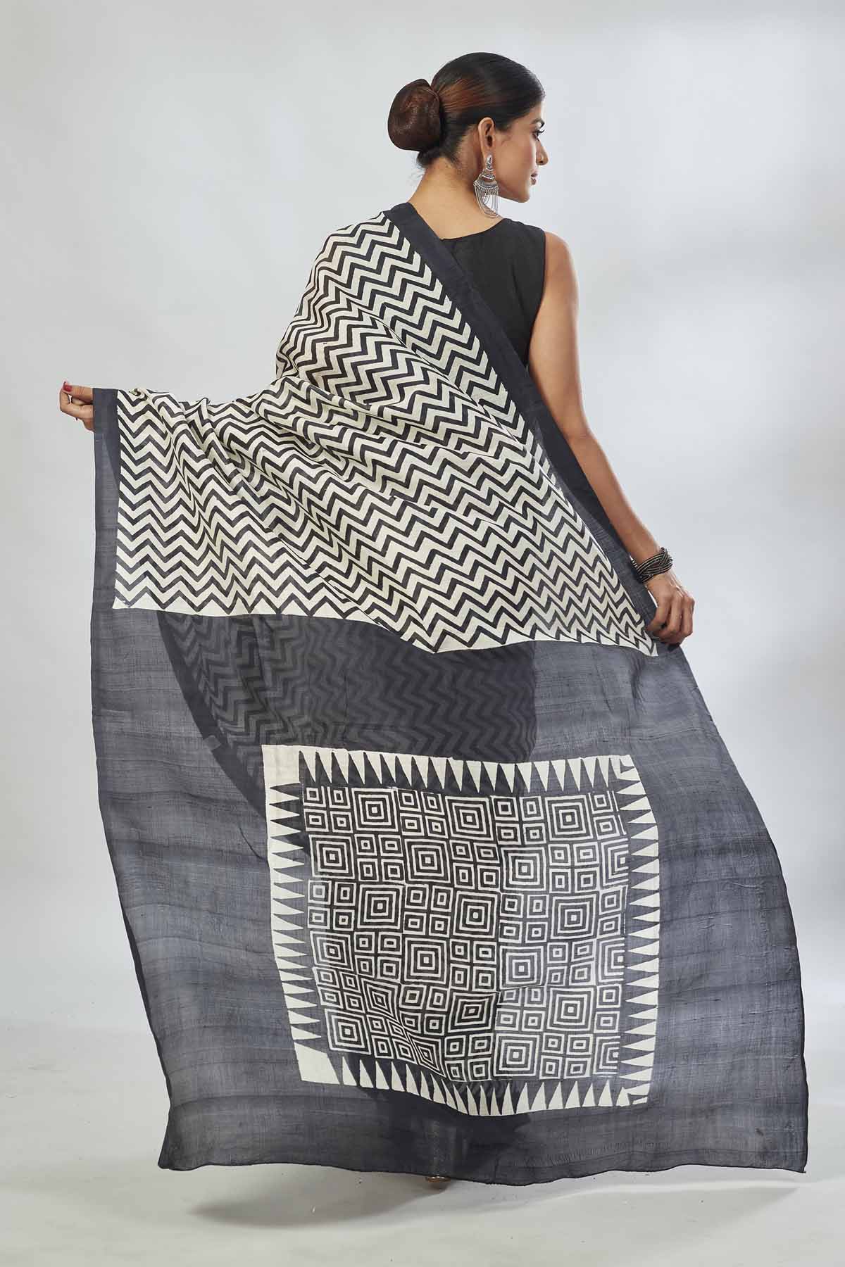 Buy white and black batik print saree online in USA. Look your best on festive occasions in latest designer saris, pure silk saris, tissue silk sarees, handwoven saris, tussar silk sarees, linen sarees,  summer sarees from Pure Elegance Indian clothing store in USA.-back