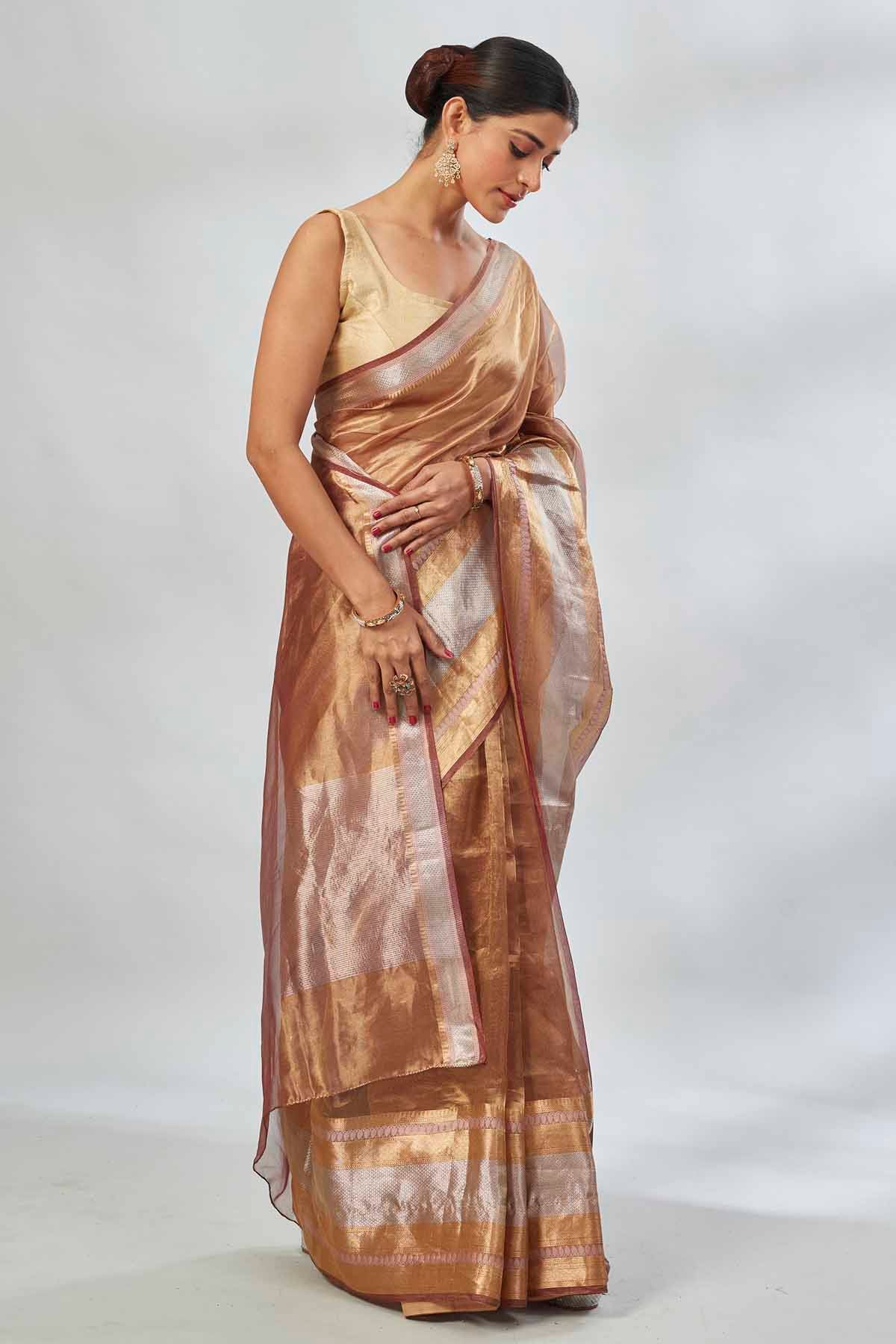 Shop golden tissue silk sari online in USA with silver stripes. Look your best on festive occasions in latest designer saris, pure silk saris, tissue silk sarees, handwoven saris, tussar silk sarees, linen sarees,  summer sarees from Pure Elegance Indian clothing store in USA.-side