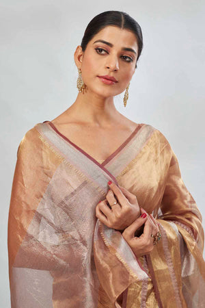 Shop golden tissue silk sari online in USA with silver stripes. Look your best on festive occasions in latest designer saris, pure silk saris, tissue silk sarees, handwoven saris, tussar silk sarees, linen sarees,  summer sarees from Pure Elegance Indian clothing store in USA.-closeup