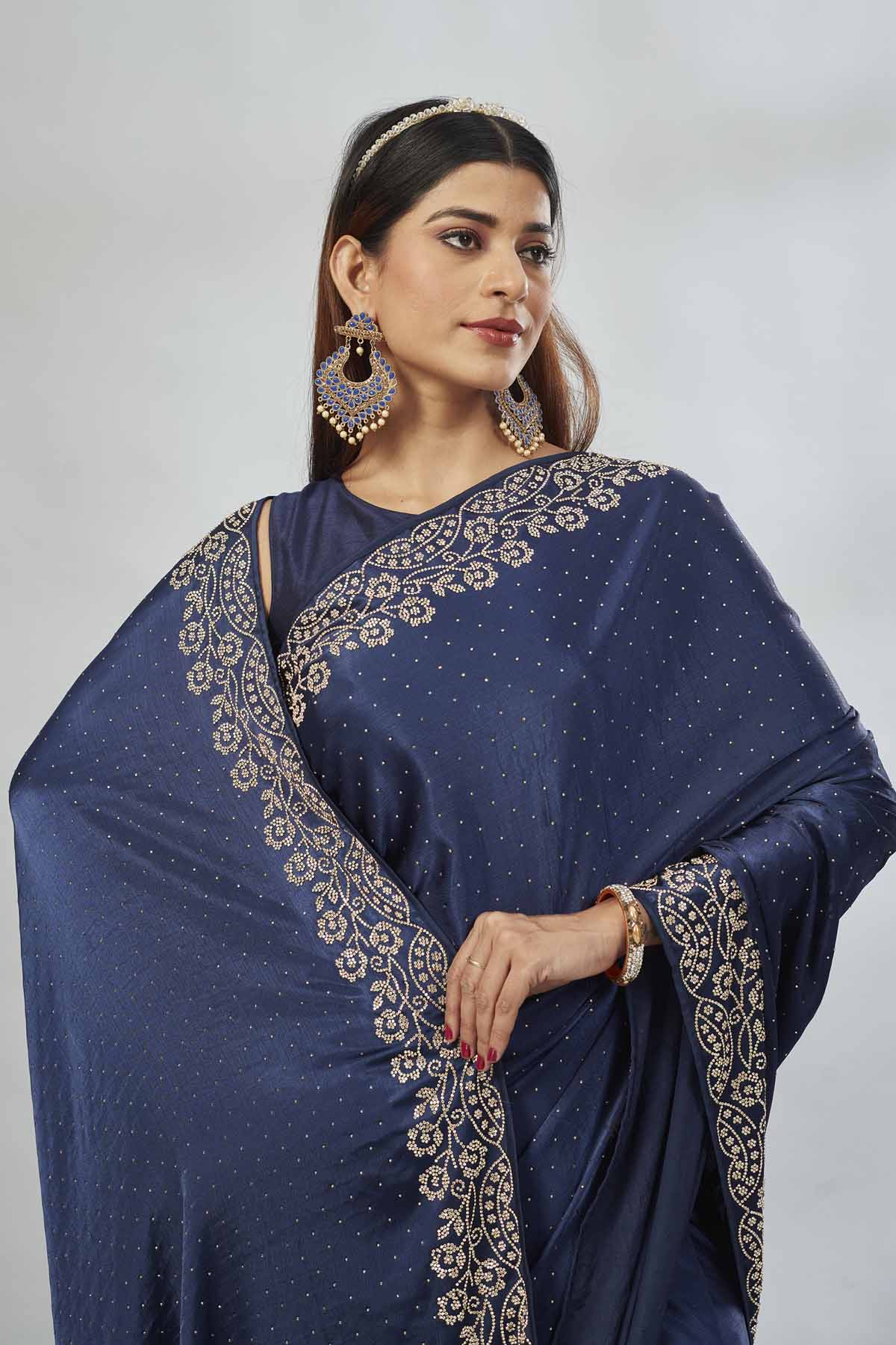 Shop navy blue stoen work crepe sari online in USA. Look your best on festive occasions in latest designer saris, pure silk saris, Kanjivaram silk sarees, handwoven saris, silk sarees, linen sarees,  embroidered sarees from Pure Elegance Indian clothing store in USA.-closeup