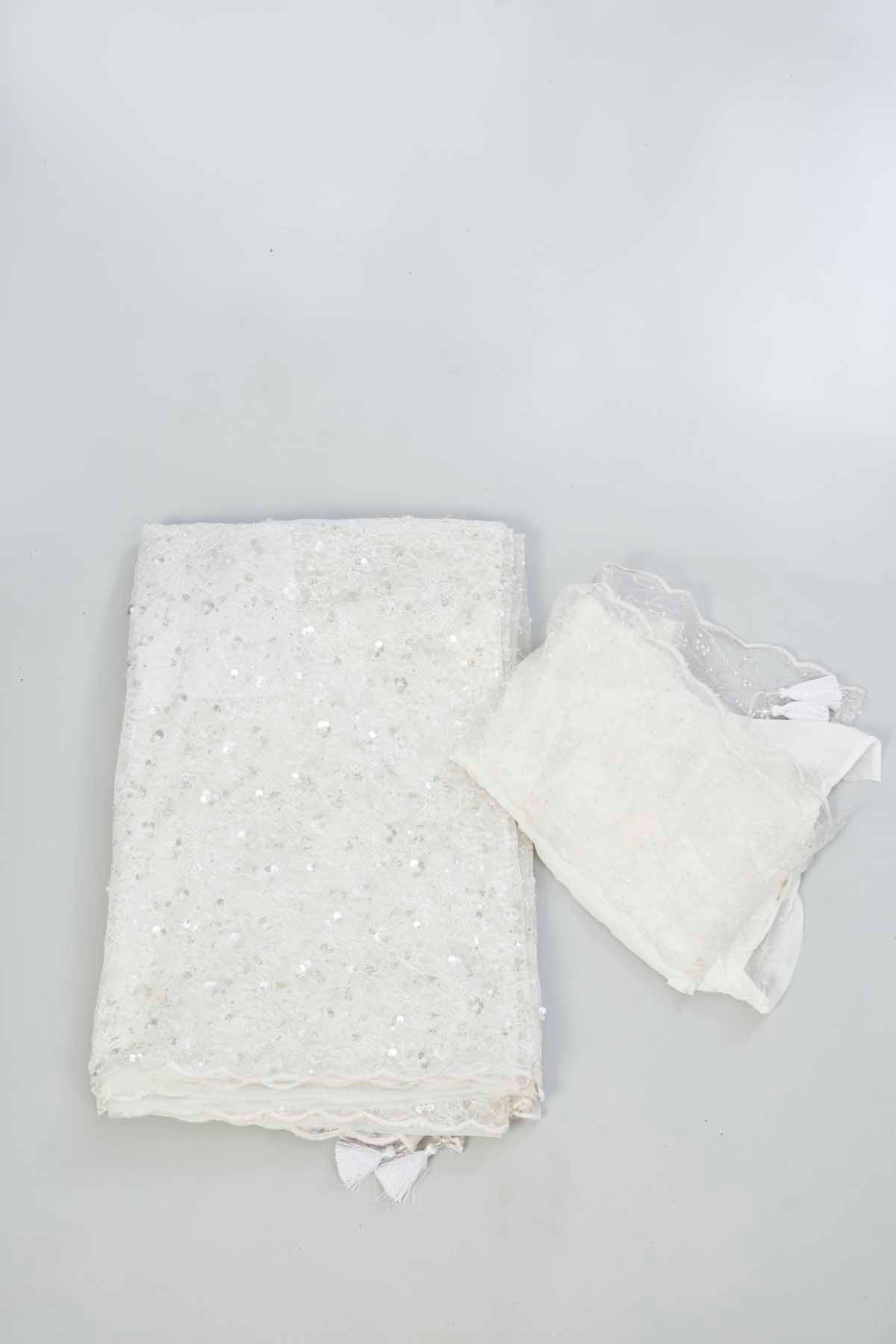 Shop off-white sequin work net sari online in USA. Look your best on festive occasions in latest designer saris, pure silk saris, Kanjivaram silk sarees, handwoven saris, silk sarees, linen sarees,  embroidered sarees from Pure Elegance Indian clothing store in USA.-blouse
