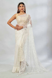 Shop off-white sequin work net sari online in USA. Look your best on festive occasions in latest designer saris, pure silk saris, Kanjivaram silk sarees, handwoven saris, silk sarees, linen sarees,  embroidered sarees from Pure Elegance Indian clothing store in USA.-full view