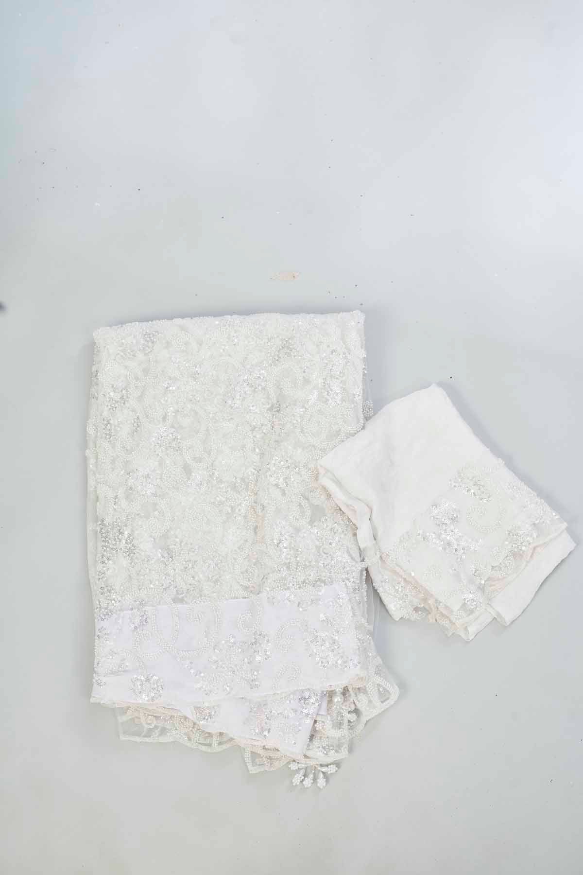 Buy off-white embroidered designer net sari online in USA. Look your best on festive occasions in latest designer saris, pure silk saris, Kanjivaram silk sarees, handwoven saris, silk sarees, linen sarees,  embroidered sarees from Pure Elegance Indian clothing store in USA.-blouse