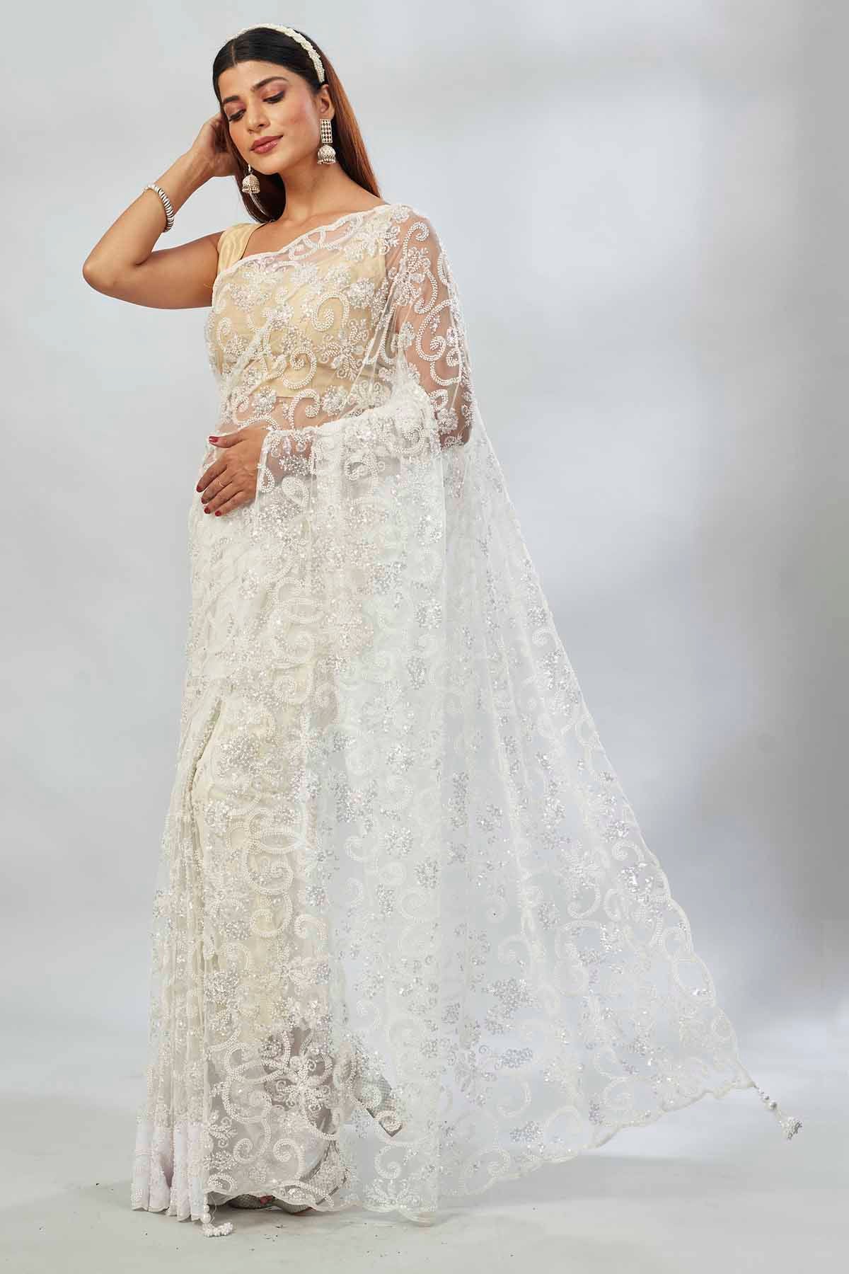 Buy off-white embroidered designer net sari online in USA. Look your best on festive occasions in latest designer saris, pure silk saris, Kanjivaram silk sarees, handwoven saris, silk sarees, linen sarees,  embroidered sarees from Pure Elegance Indian clothing store in USA.-pallu