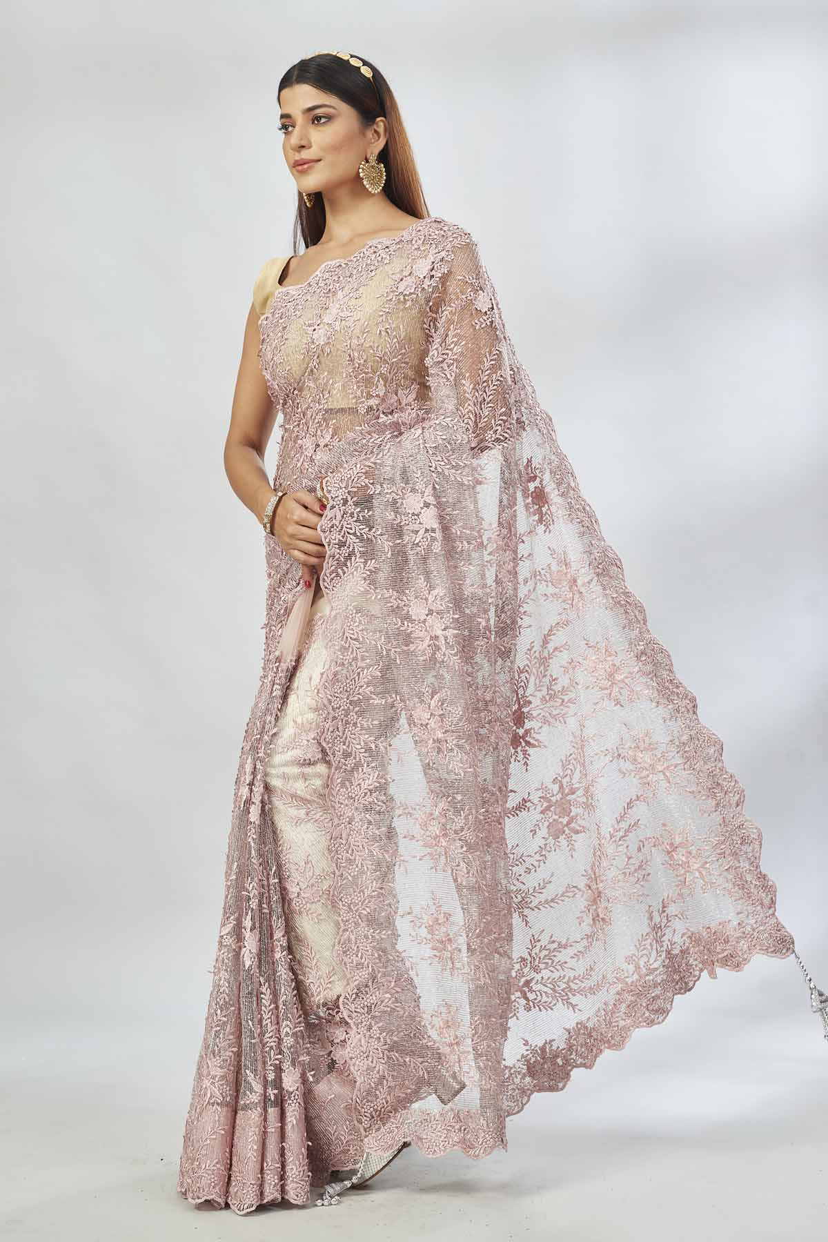Shop dusty pink embroidered designer net sari online in USA. Look your best on festive occasions in latest designer saris, pure silk saris, Kanjivaram silk sarees, handwoven saris, silk sarees, linen sarees,  embroidered sarees from Pure Elegance Indian clothing store in USA.-pallu