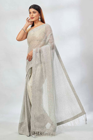 Buy light grey embroidered sequin net sari online in USA. Look your best on festive occasions in latest designer saris, pure silk saris, Kanjivaram silk sarees, handwoven saris, silk sarees, linen sarees,  embroidered sarees from Pure Elegance Indian clothing store in USA.-pallu