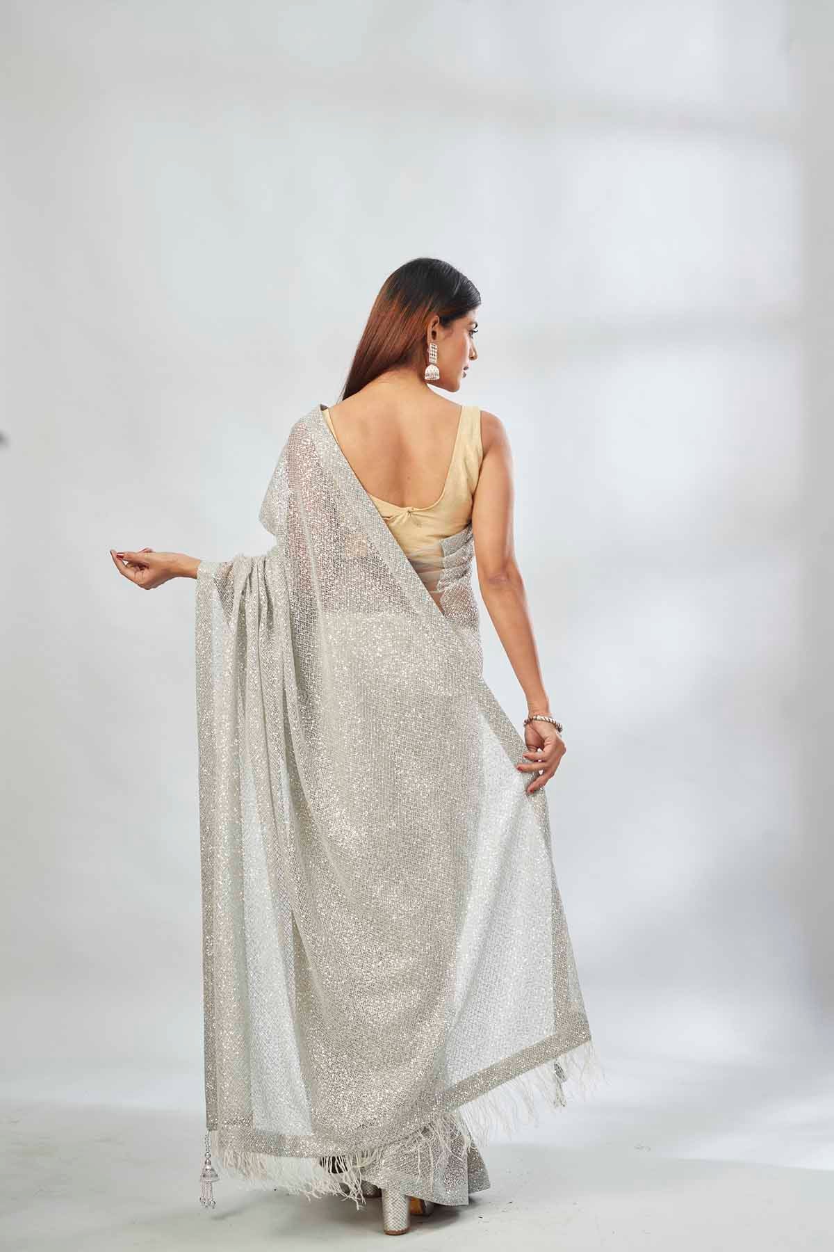 Buy light grey embroidered sequin net sari online in USA. Look your best on festive occasions in latest designer saris, pure silk saris, Kanjivaram silk sarees, handwoven saris, silk sarees, linen sarees,  embroidered sarees from Pure Elegance Indian clothing store in USA.-back