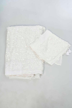 Buy beautiful white embroidered net designer sari online in USA. Look your best on festive occasions in latest designer saris, pure silk saris, Kanjivaram silk sarees, handwoven saris, silk sarees, linen sarees,  embroidered sarees from Pure Elegance Indian clothing store in USA.-blouse
