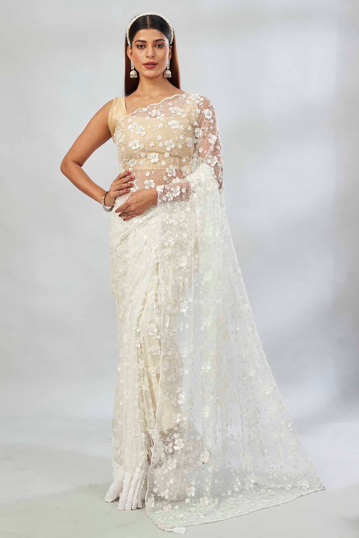 Buy beautiful white embroidered net designer sari online in USA. Look your best on festive occasions in latest designer saris, pure silk saris, Kanjivaram silk sarees, handwoven saris, silk sarees, linen sarees,  embroidered sarees from Pure Elegance Indian clothing store in USA.-full view