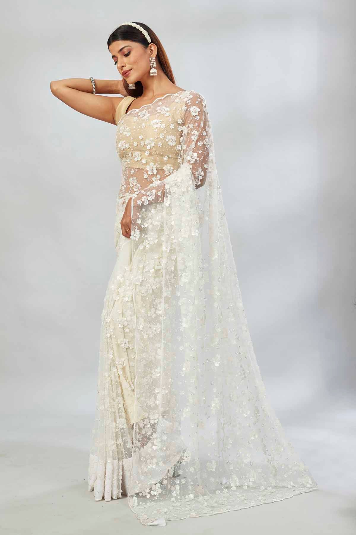 Buy beautiful white embroidered net designer sari online in USA. Look your best on festive occasions in latest designer saris, pure silk saris, Kanjivaram silk sarees, handwoven saris, silk sarees, linen sarees,  embroidered sarees from Pure Elegance Indian clothing store in USA.-pallu