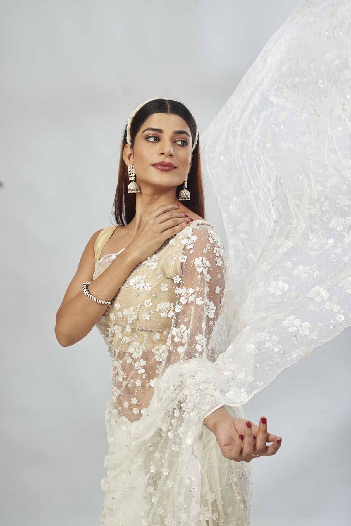 Buy beautiful white embroidered net designer sari online in USA. Look your best on festive occasions in latest designer saris, pure silk saris, Kanjivaram silk sarees, handwoven saris, silk sarees, linen sarees,  embroidered sarees from Pure Elegance Indian clothing store in USA.-closeup