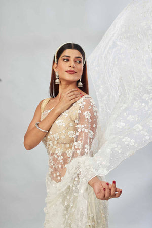 Buy beautiful white embroidered net designer sari online in USA. Look your best on festive occasions in latest designer saris, pure silk saris, Kanjivaram silk sarees, handwoven saris, silk sarees, linen sarees,  embroidered sarees from Pure Elegance Indian clothing store in USA.-closeup